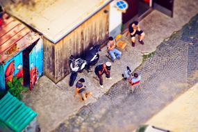 Colorful people, near the workshop in light