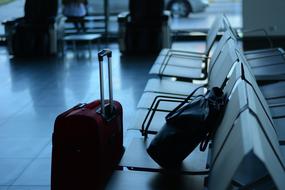 luggage on a bench at the airport