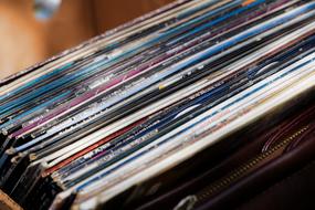 a stack of vinyl records in a package