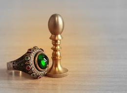 photo rings with emeralds and a gold seal