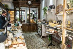 various craft Cheese on stall in shop, paris