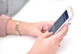 businesswoman holding smartphone
