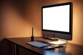 Apple Imac and Iphone on table