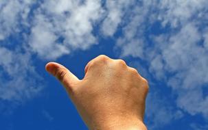 thumb in the blue sky