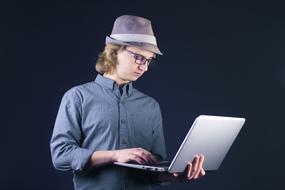 Laptop man in hat