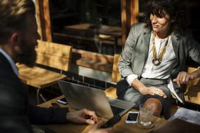 business people sit at a table in a cafe