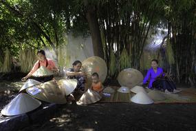 women making cone leaves in Vietnam