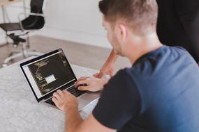 Coding, young man Programming at desk