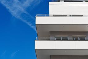 Balconies of the House and blue sky with white clouds