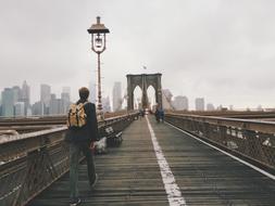 brooklyn bridge and man