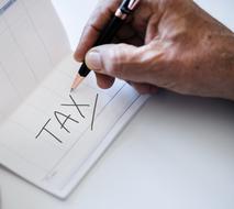 tax text man pen