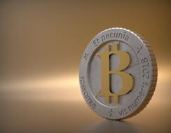 Bitcoin coin on a gold background