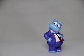 funny figurine of a hippo in a business suit