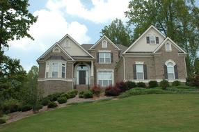mansion on hill side in park