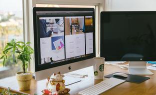 monitors on the table in a home office