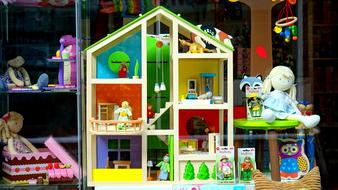 photo of a dollhouse in a shop window