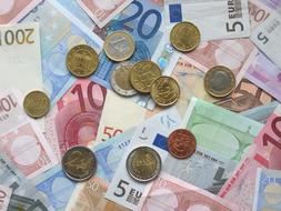 Euro Banknotes and Coins, flat lay