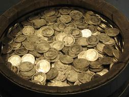 photo of barrel with gold coins