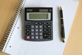 Calculator and Pen and note