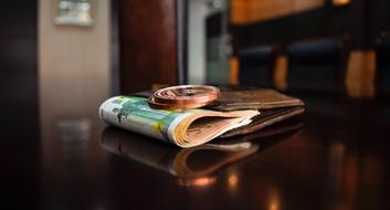 Banknote and Coin Euro on table