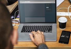 back view of male person working with Computer