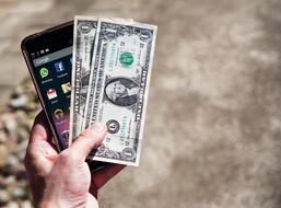 Mobile Phone and Money in hand