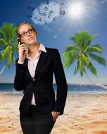 businesswoman with phone on the beach