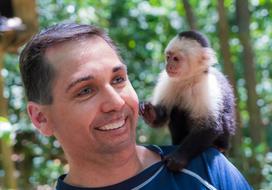 Portrait man and White-Faced Capuchin