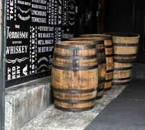 Whiskey Barrels at wall in pub