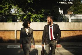 colleagues are walking down the street