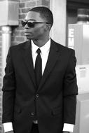 african Man in tie suit and sunglasses