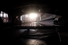 bright light in the dark of an industrial building