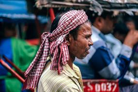 Asian Man On Crowded Streets In Delhi