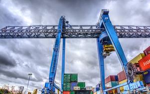 Loading crane and colorful Containers in Port