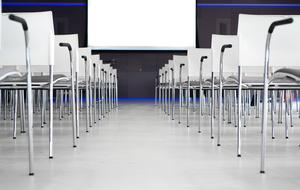 drawn chairs and blackboard in a conference room