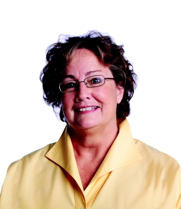 woman with glasses and yellow blouse