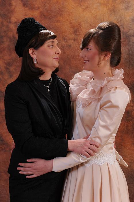 Adult and young women standing together