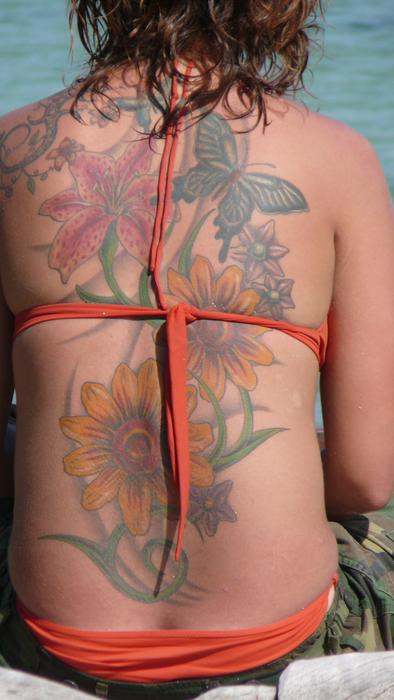 flowers and butterfly, Tattoo on back of Woman