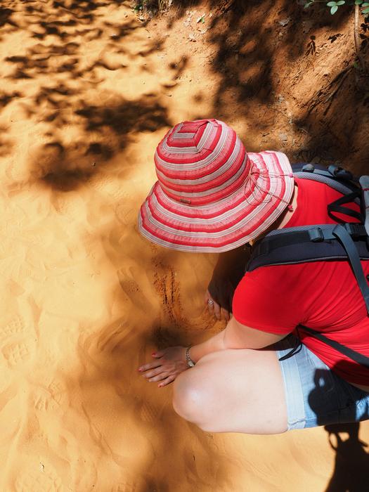 woman playing in the sand