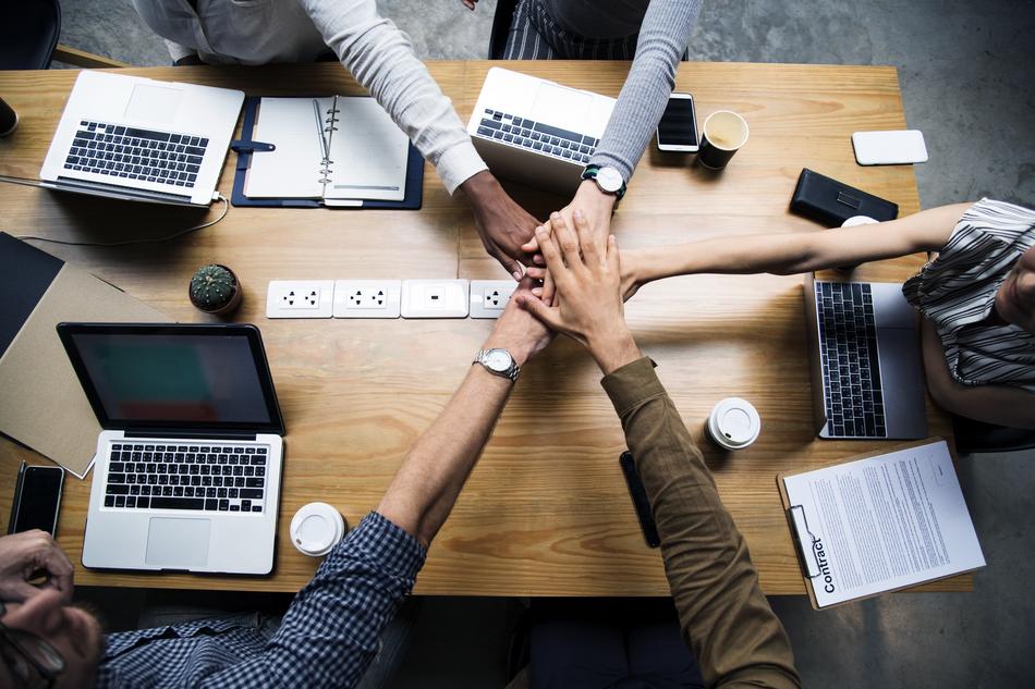hands over the table in the office