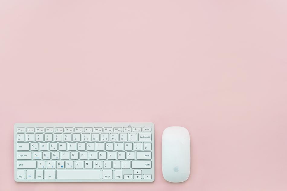white keyboard and mouse on pink background