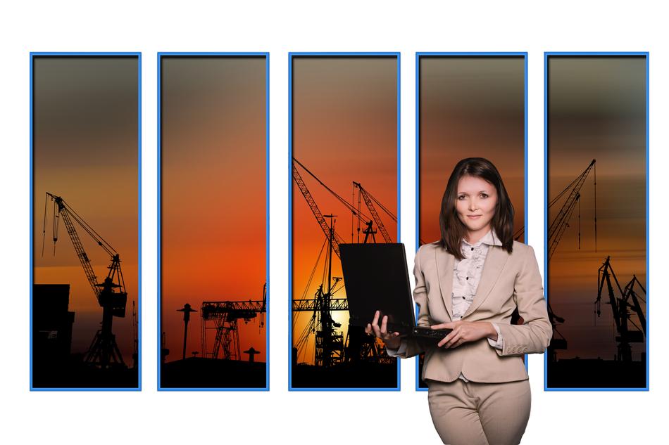 business woman with laptop on the background of port cranes