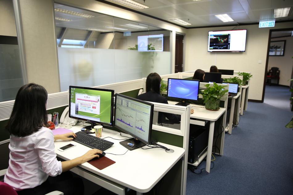 People, working on the computers on the office with lights