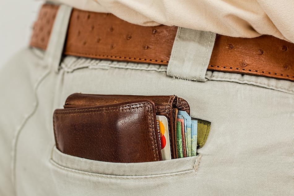 closeup picture of Wallet with Cash and Credit Cards in rear pocket