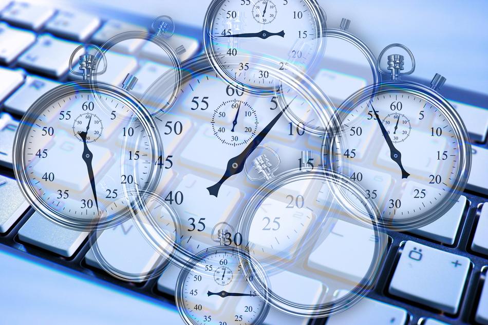 image of stopwatch on the background of the keyboard