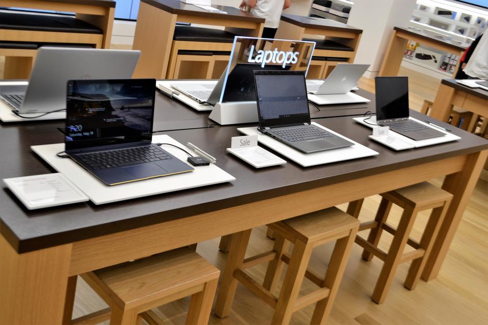 Laptops on desk in store