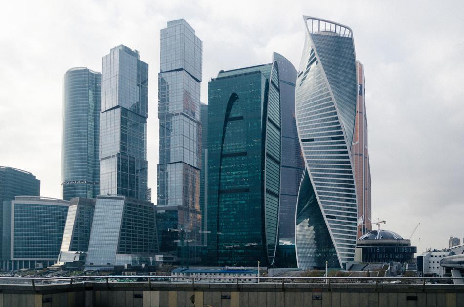 Shiny Moscow City buildings in Moscow, Russia, under the cloudy sky