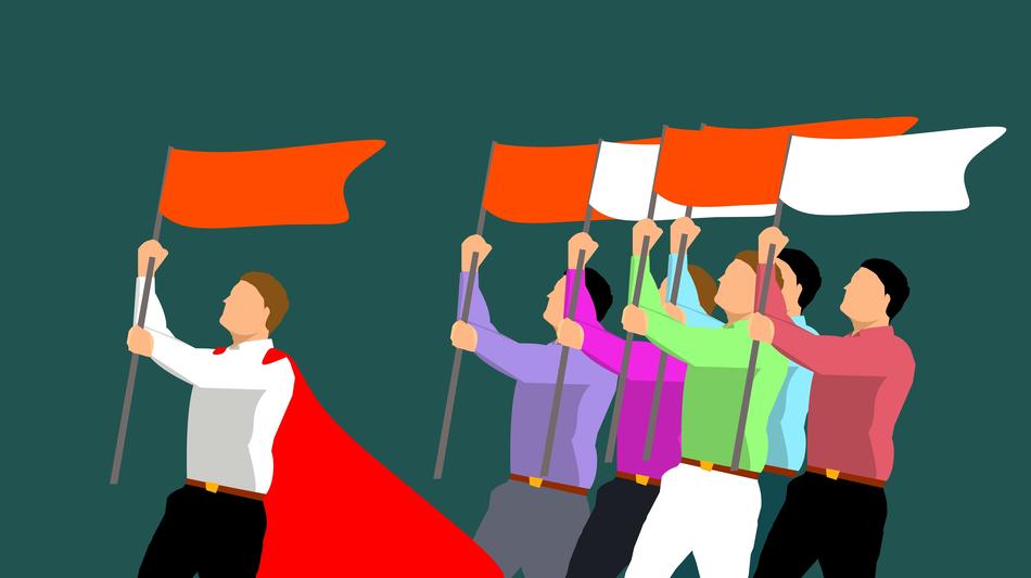 People in colorful clothes with the white and red flags at green background