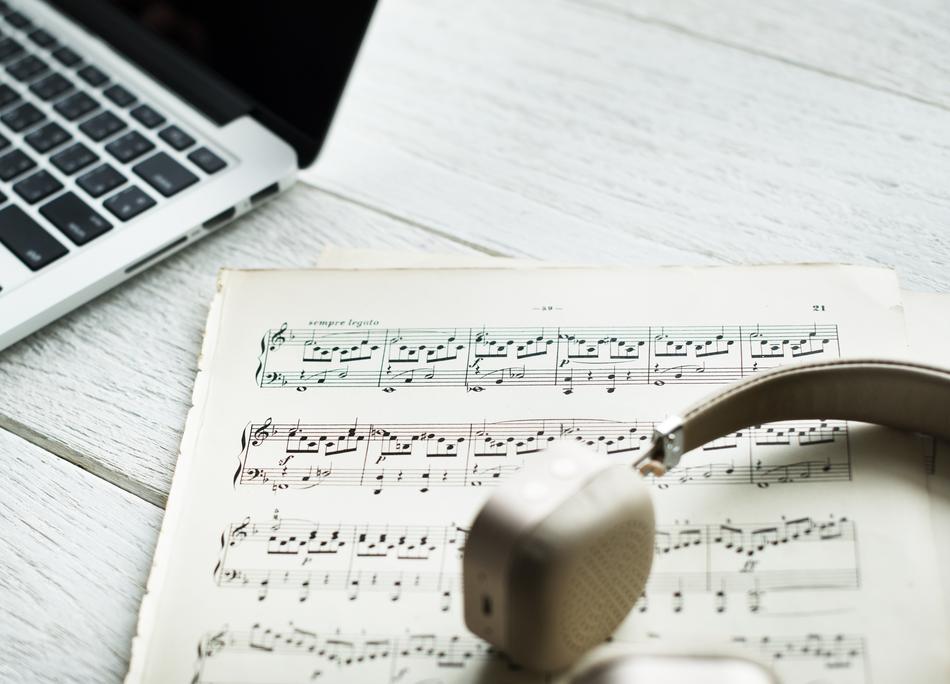 headphones on notes near the laptop