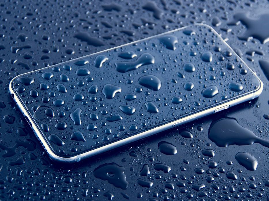 Beautiful Iphone 6s plus with blue screen in water drops